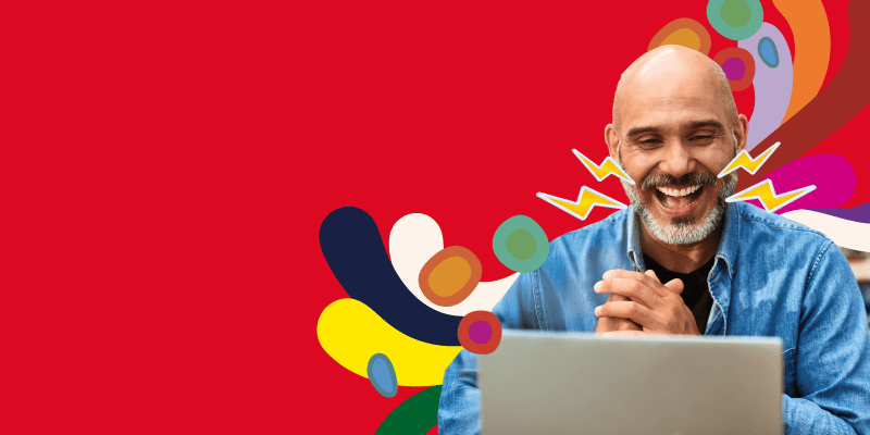 Man laughing on computer