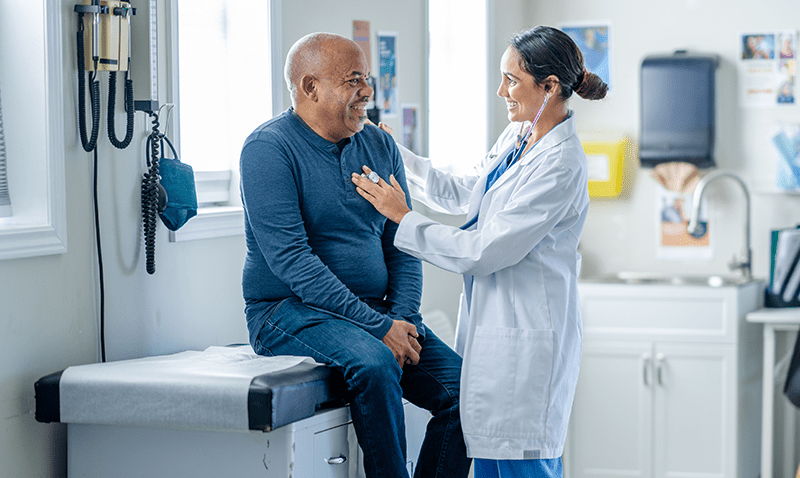 Older man getting health check from doctor