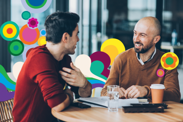Two men chatting and smiling