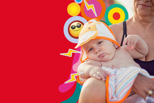 Baby wearing hat being carried