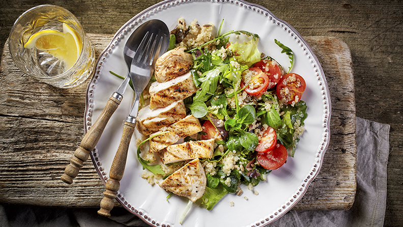 Quinoa and vegetable salad and grilled chicken fillet