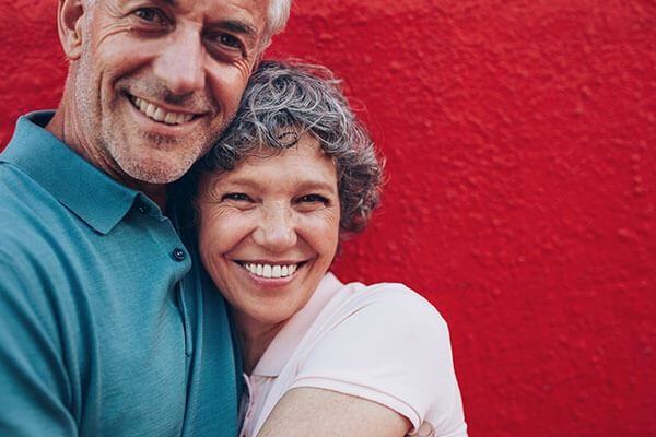 Couple hugging and smiling 