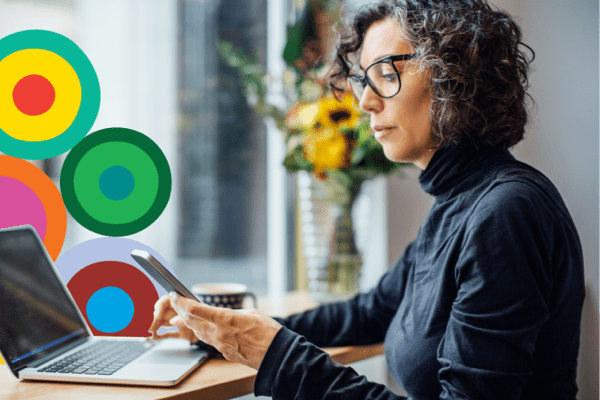 Woman looking at phone while working