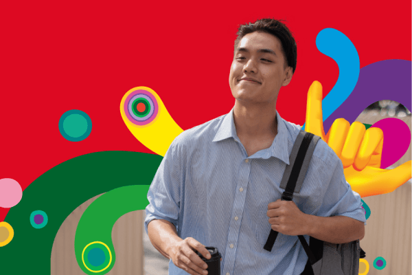 Happy overseas student sitting in front of a laptop