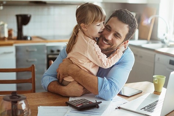 Father hugging daughter